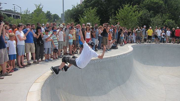 Tony Hawk grinds through a pocket as the crowd crowds the lip...look at all the people!