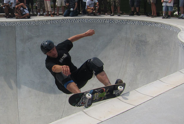 Death skateboards pro Dave Allen grinding up coping in the deep end.